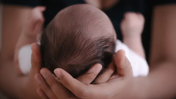 Maternal Cells Found in Children's Brains, Persisting for Decades